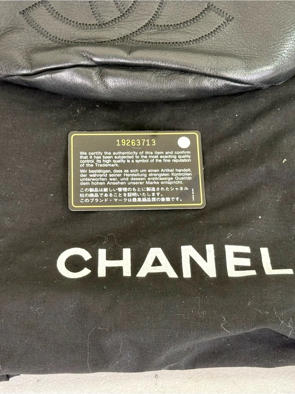 CHANEL CC LOGO BUCKET BAG IN BLACK LAMBSKIN LEATHER
